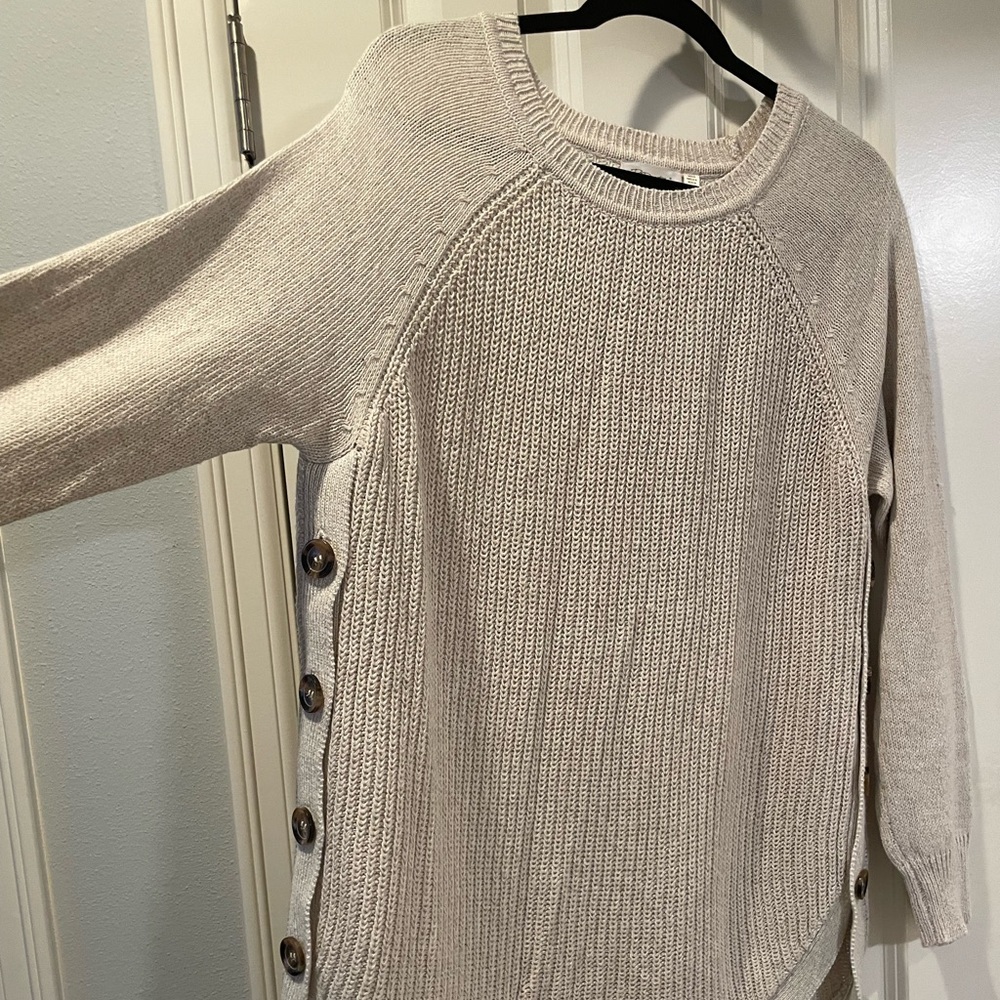 Cream sweater with button enclosed sides